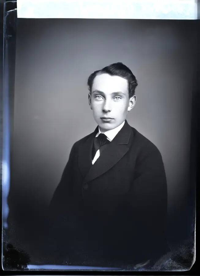 The same portrait cleaned, every facial feature kept exactly the same