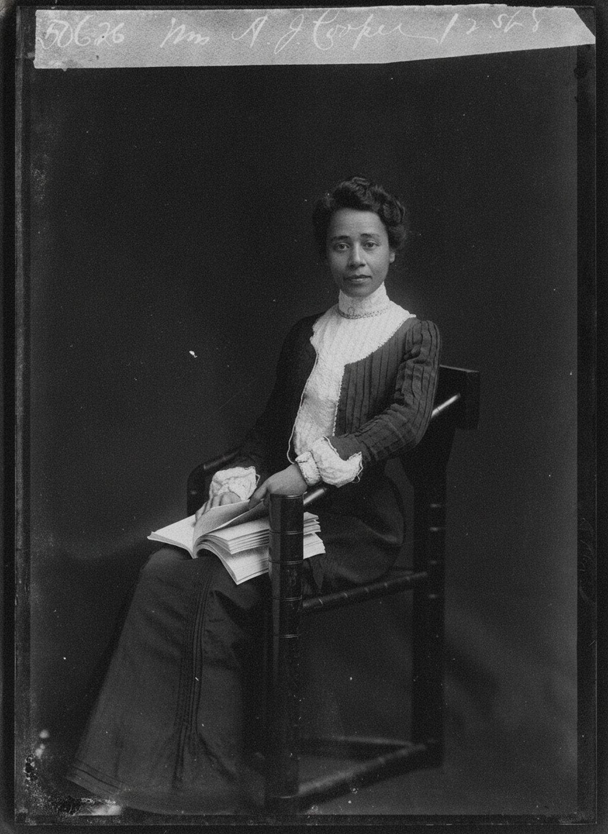 After: 1902 studio portrait — glass-plate edge damage and emulsion loss restored