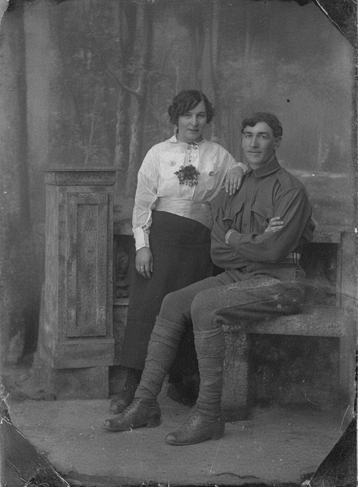 After: 1914 studio portrait of a couple — heavy edge emulsion-loss, tears and stains repaired