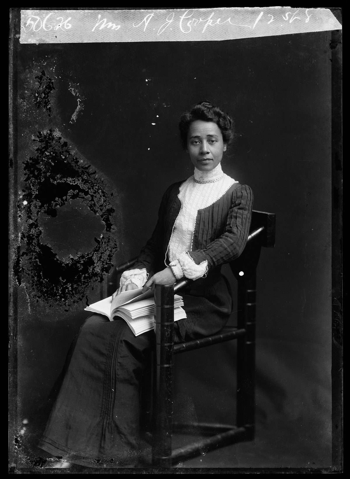 Before: 1902 studio portrait — glass-plate edge damage and emulsion loss restored