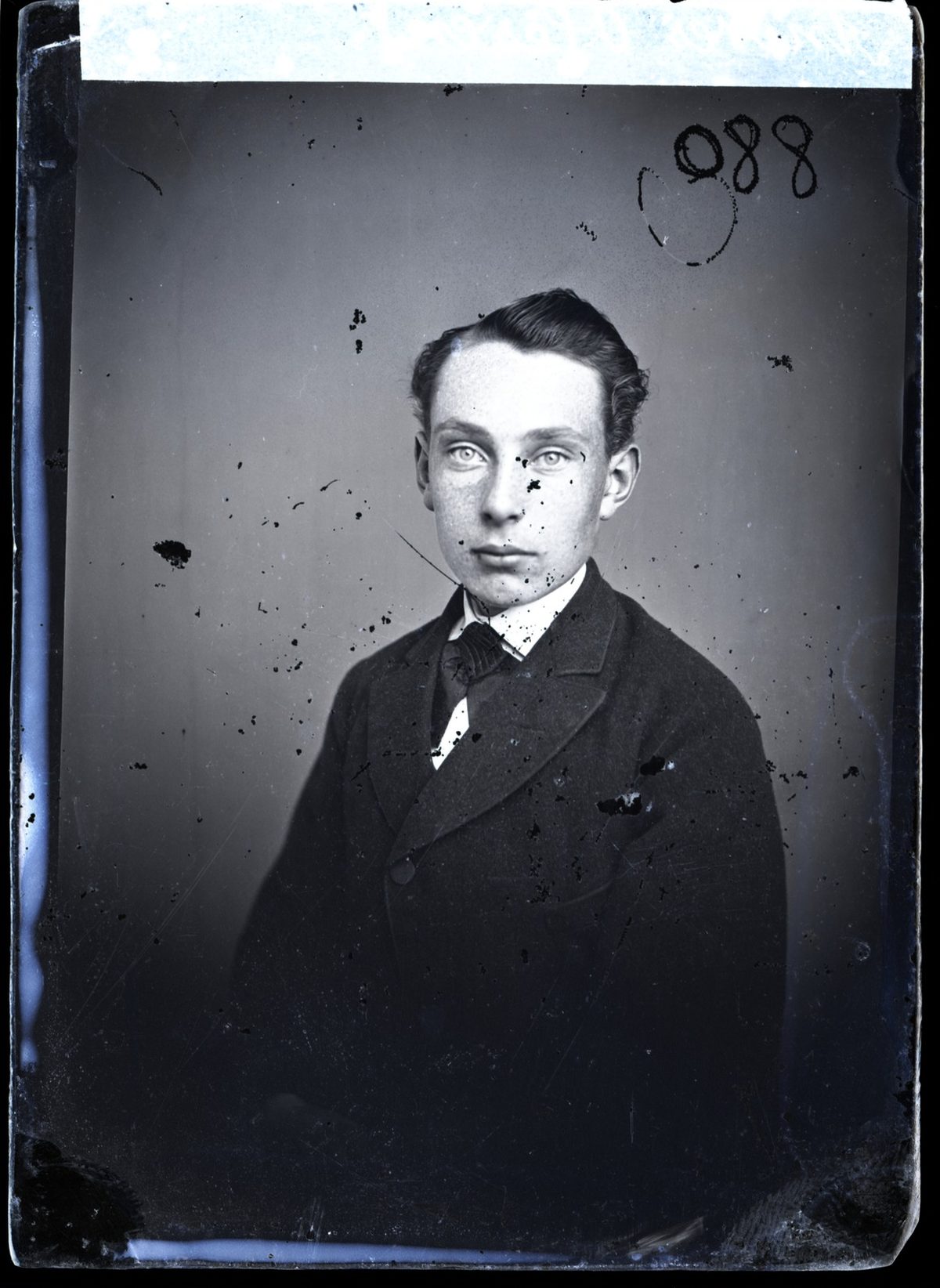 Before: Glass-plate studio portrait — deep scratches and plate damage repaired
