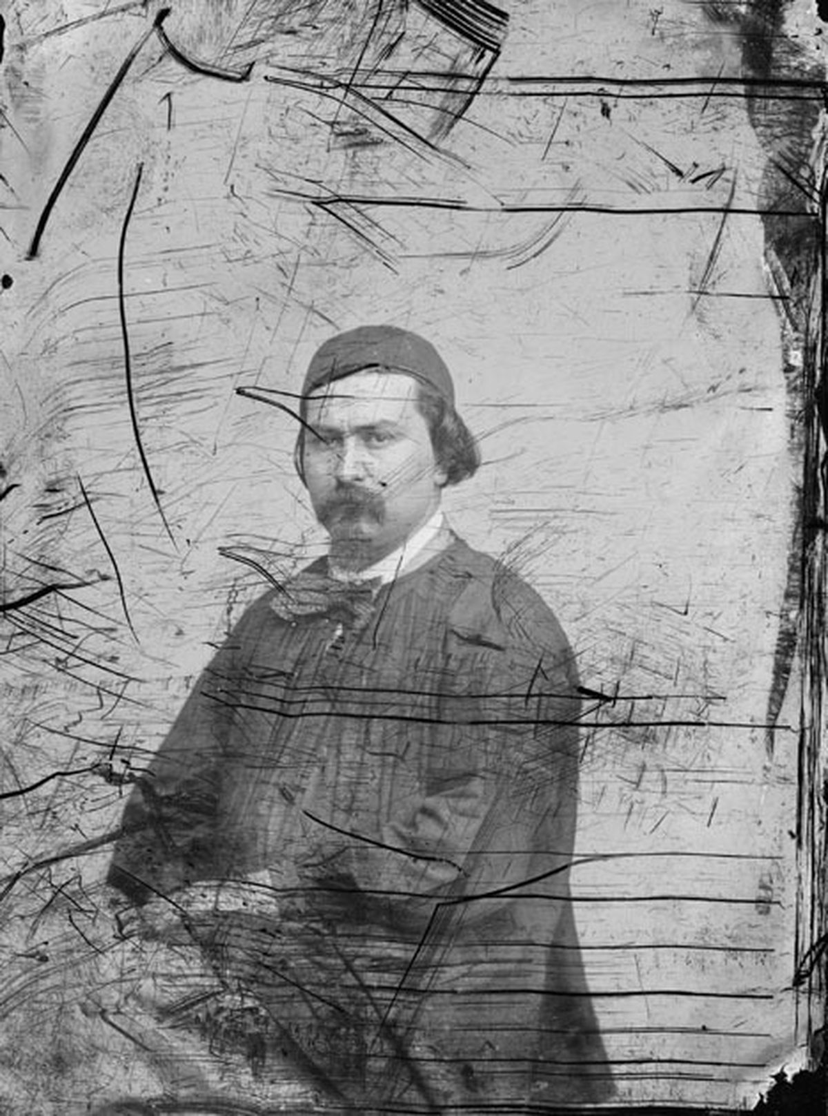 Before: 1860s studio portrait — pen scratches, ink marks and surface abrasion removed